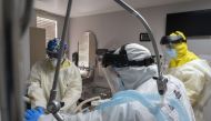 HOUSTON, TX - JULY 2: Members of the medical staff treat a patient in the COVID-19 intensive care unit at the United Memorial Medical Center on July 2, 2020 in Houston, Texas. COVID-19 cases and hospitalizations have spiked since Texas reopened, pushing i