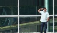 Brazilian President Jair Bolsonaro gestures outside the Alvorada Palace in Brasilia, Brazil, on July 14, 2020, in the midst of the COVID-19 coronavirus pandemic. Bolsonaro tested positive for the coronavirus on July 7, after months minimizing the dangers 