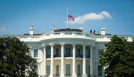 The American flag is lowered to half-staff following the death of Congressman John Lewis (D-GA), as U.S. President Donald Trump arrives after playing golf at his club in Sterling, Virginia, at the White House in Washington, U.S., July 18, 2020. REUTERS/Al