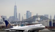 FILE PHOTO: A united airlines passenger jet takes off with New York City as a backdrop, at Newark Liberty International Airport, New Jersey, U.S. December 6, 2019. REUTERS/Chris Helgren/File Photo

