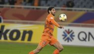 This file photo taken on April 9, 2019 shows Shandong Luneng's Marouane Fellaini running with the ball during the AFC Champions League group stage football match between China's Shandong Luneng and Malaysia's Johor Darul Ta'zim in Jinan in China's eastern