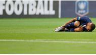 Soccer Football - Coupe de France - Final - Paris St Germain v AS Saint-Etienne - Stade de France, Saint-Denis near Paris, France - July 24, 2020 Paris St Germain's Kylian Mbappe reacts after sustaining an injury, following the outbreak of the coronavirus