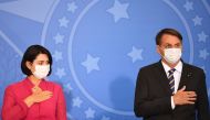 Brazilian President Jair Bolsonaro and the first lady Michelle Bolsonaro attend the launch of the Rural Women's Rights program at Planalto Palace in Brasilia, on July 29, 2020. This is the first public appearance of Bolsonaro in an official event after he