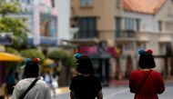FILE PHOTO: People visit the largely empty Universal Studios Singapore, as tourism takes a decline following the coronavirus outbreak, in Sentosa March 4, 2020. REUTERS/Edgar Su/File Photo