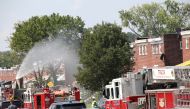 Fire trucks are seen at the scene of an explosion in a residential area of Baltimore, Maryland, U.S. August 10, 2020. REUTERS/Rosem Morton