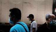 :NEW YORK, NEW YORK - AUGUST 10: People walk through New York City's Chinatown on August 10, 2020 in New York City.  Spencer Platt/ AFP 
