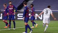 Bayern Munich's Polish forward Robert Lewandowski (R) celebrates after scoring his team's sixth goal during the UEFA Champions League quarter-final football match between Barcelona and Bayern Munich at the Luz stadium in Lisbon on August 14, 2020. / AFP /