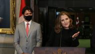 Canada's Deputy Prime Minister/Finance Minister Chrystia Freeland (R) speaks during a news conference on Parliament Hill August 18, 2020 in Ottawa, Canada, as Prime Minister Justin Trudeau looks. / AFP / Dave Chan 
