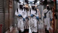 Soldiers from the 4th Military Region of the Brazilian Armed Forces take part in the cleaning and disinfection of the Municipal Market in the Belo Horizonte, state of Minas Gerais, Brazil on August 18, 2020, amid the COVID-19 coronavirus pandemic. / AFP /