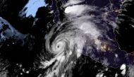 This RAMMB/NOAA satellite image obtained on August 18, 2020, shows Hurricane Genevieve moving towards Baja California on August 19, 2020 at 05:10:21 UTC. AFP PHOTO / RAMMB/NOAA