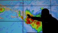 FILE PHOTO: A member of the Emergency Operations Committee (COE) monitors the trajectory of Storm Laura in Santo Domingo, Dominican Republic August 22, 2020. REUTERS/Ricardo Rojas -/File Photo

