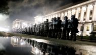 Law enforcement officers guard during a protest following the police shooting of Jacob Blake, a Black man, in Kenosha, Wisconsin, U.S. August 25, 2020. REUTERS/Brendan McDermid TPX