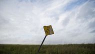 SABINE PASS, TX - AUGUST 26: A general view of a street sign in a field ahead of Hurricane Laura on August 26, 2020 in Sabine Pass, Texas. Hurricane Laura, currently a Category 4 storm, is expected to make landfall along the Gulf Coast late Wednesday and 