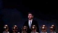FILE PHOTO: Soccer Football - The Ballon d’Or awards - Theatre du Chatelet, Paris, France - December 2, 2019 Barcelona's Lionel Messi with his six Ballon d'Or trophies REUTERS/Christian Hartmann/File Photo
