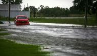 A car near Vermilion Bay is seen partially submerged in waters brought by Hurricane Laura approaching Abbeville, Louisiana, U.S., August 26, 2020. REUTERS/Kathleen Flynn REFILE - CORRECTING INFORMATION