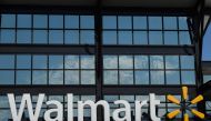 In this file photo a Walmart logo is seen outside a store in Washington, DC, on August 18, 2020. US retail giant Walmart said on August 27, 2020 it had teamed with Microsoft in a bid to buy short-form video app TikTok. / AFP / NICHOLAS KAMM