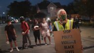 KENOSHA, WISCONSIN - AUGUST 26: Demonstrators protest the shooting of Jacob Blake on August 26, 2020 in Kenosha, Wisconsin. A police officer shot Blake seven times in the back in front of his three children. The shooting sparked three consecutive days of 