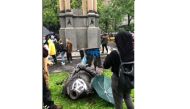 Statue of John MacDonald is seen on the ground after it was pulled down during a protest against racial inequality, in Montreal, Quebec, Canada August 29, 2020 in this picture obtained from social media. Instagram - @andelinaht/via REUTERS
