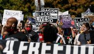 PORTLAND, OREGON, USA - AUGUST 28: Protesters hold banners during a march led by the NAACP and a youth group, Fridays 4 Freedom, to commemorate Martin Luther King’s 1963 Washington DC march, at the Convention Center in Portland, Oregon, on August 28, 2020