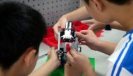 Elementary school students build a motion sensor controlled disinfectant dispenser from lego parts during a workshop, following a novel coronavirus outbreak, in the southern Taiwanese city of Kaohsiung, Taiwan March 9, 2020. REUTERS/Fabian Hamacher/File P