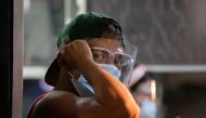 A passenger wears a face mask and face shield on board a bus, amid the coronavirus disease (COVID-19) outbreak, in Quezon City, Metro Manila, Philippines, September 7, 2020. REUTERS/Eloisa Lopez
