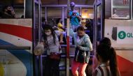 Passengers wearing face shields and face masks for protection against the coronavirus disease (COVID-19) get off a bus in Quezon City, Metro Manila, Philippines, September 7, 2020. REUTERS/Eloisa Lopez