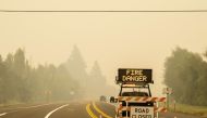 A sign warning of impending fire danger is posted on September 10, 2020 in Estacada, Oregon. Multiple wildfires grew by hundreds of thousands of acres Thursday, prompting large-scale evacuations throughout the state. Nathan Howard/Getty Images/AFP