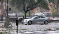 A car drives down Government Street during Hurricane Sally in Mobile, Alabama, U.S., September 16, 2020. REUTERS/Jonathan Bachman