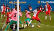 Barcelona's Argentinian forward Lionel Messi (C) challenges Girona's Malian midfielder Ibrahima Kebe (R) during a friendly football match between FC Barcelona and Girona at the Johan Cruyff stadium in Sant Joan Despi near Barcelona on September 16, 2020. 