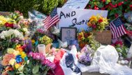 People leave flowers outside of the US Supreme Court in memory of Justice Ruth Bader Ginsburg, in Washington, DC, on September 19, 2020. Ginsburg died September 18, opening a crucial vacancy on the high court expected to set off a pitched political battle