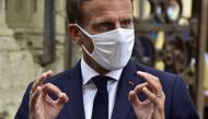 French President Emmanuel Macron wearing a protective face mask speaks to journalists during a visit at the Polignac castle on September 18, 2020 in Condom, on the eve of the European Heritage Days and the third edition of the 