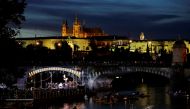 People watch a classical concert on a floating stage on Vltava river as the spread of the coronavirus disease (COVID-19) continues in Prague, Czech Republic, September 19, 2020. REUTERS/David W Cerny
 