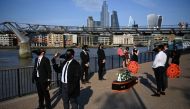 Musicians perform a staged funeral for the 