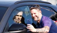 Gareth Bale poses for a photo with a fan as he leaves London Luton Airport. Gareth Bale is expected to complete his return to Tottenham Hotspur. Reuters/Paul Childs
