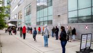 FILE PHOTO: People wait in line at the Women's College coronavirus disease (COVID-19) testing facility in Toronto, Ontario, Canada September 18, 2020. REUTERS/Carlos Osorio/File Photo
