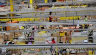 FILE PHOTO: Amazon workers perform their jobs inside an Amazon fulfillment center on Cyber Monday in Robbinsville, New Jersey, U.S., December 2, 2019. REUTERS/Lucas Jackson/File Photo
