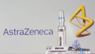 A test tube labelled with the Vaccine is seen in front of AstraZeneca logo in this illustration taken, September 9, 2020. REUTERS/Dado Ruvic/Illustration/File Photo