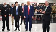 US President Donald Trump (C) listens to US Senator Ron Johnson (R), Republican of Wisconsin, during a tour of an emergency operations center at Mary D. Bradford High School in Kenosha. AFP / MANDEL NGAN

