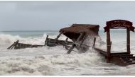 A pier is washed away by Tropical Storm Gamma in Cozumel, Mexico, October 3, 2020, in this still image from video obtained via social media. @THE_KLUTE via REUTERS