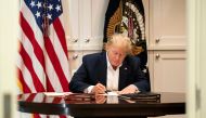 US President Donald Trump working in the Presidential Suite at Walter Reed National Military Medical Center in Bethesda, Maryland on October 3, 2020, after testing positive for COVID-19.  AFP / The White House 