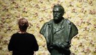 In this file photo taken on December 10, 2019 a visitor stands in front of a bust of the Nobel Prize founder, Alfred Nobel prior the Nobel awards ceremony at the Concert Hall in Stockholm, Sweden. Swedish inventor and scholar Alfred Nobel, who made a vast