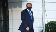 U.S. President Trump walks to the Marine One helicopter wearing a protective face mask as he departs the White House to fly to Walter Reed National Military Medical Center, where it was announced he will work for at least several days after testing positi