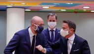 Belgium's Prime Minister Alexander De Croo, European Council President Charles Michel and Luxembourg's Prime Minister Xavier Bettel react at the start of the second face-to-face European Union summit since the coronavirus disease (COVID-19) outbreak, in B