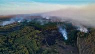 This handout picture taken and released by the Russian Emergencies Ministry on October 8, 2020 shows smoke rising from a fire at a munitions depot in the Ryazan region.AFP PHOTO / Russian Emergencies Ministry / handout 