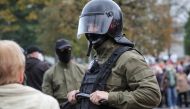 Law enforcement officers block opposition supporters, mostly pensioners, during a rally to reject the presidential election results in Minsk, Belarus October 12, 2020. REUTERS/Stringer