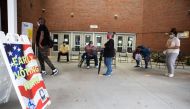 People stand in line on the first day of early voting for the general election at the C.T. Martin Natatorium and Recreation Center on October 12, 2020 in Atlanta, Georgia. 
