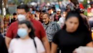 FILE PHOTO: People walk on the street, as the coronavirus disease (COVID-19) outbreak continues, in MEXICO City, MEXICO October 8, 2020. REUTERS/Carlos Jasso/File Photo
