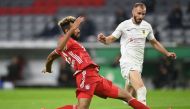 Bayern Munich's Cameroonian forward Eric Maxim Choupo-Moting scores the opening goal past Dueren's Bosnian-German midfielder Adis Omerbasic (R) during the German Cup (DFB Pokal) first round football match 1. / AFP / CHRISTOF STACHE