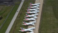 A line of American Airlines Boeing 737 MAX passenger planes are parked on the tarmac at Tulsa International Airport in Tulsa, Oklahoma, U.S., March 23, 2020. REUTERS/Nick Oxford/File Photo
