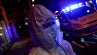 Madrid Emergency Service (SUMMA) UVI-8 unit's medical resident Mireya Nadal wearing full protective gear prepares to treat a patient in his home amid the coronavirus disease (COVID-19) outbreak in Madrid, Spain, October 19, 2020. Picture taken October 19,